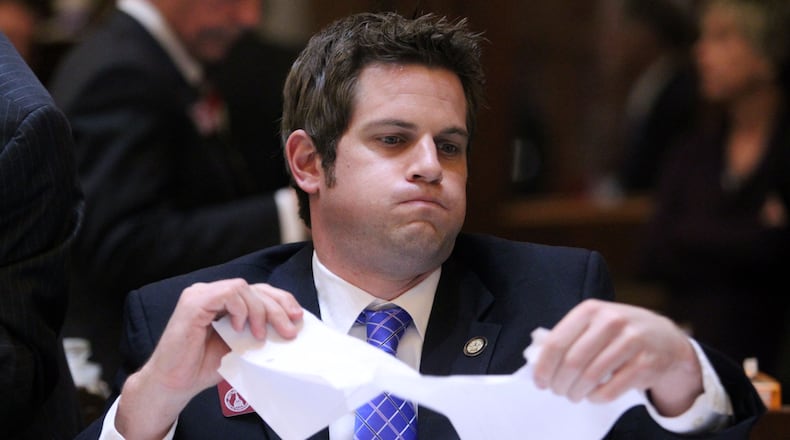 March 28, 2013 - Atlanta, Ga: Rep. Brian Strickland, R-McDonough, begins to rip paper in pieces in preparation for, “Sine Die,” before the closing of Legislative Day 40 in the House Chambers at the Capitol Thursday night in Atlanta, Ga., March 28, 2013. Thursday is the last day of the 2013 Legislative Session, Legislative Day 40.