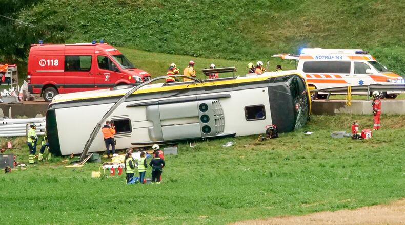 Emergency personnel respond to an accident involving a tour bus near Susch, in the canton of Grisons, Switzerland, on Thursday, Sept. 10, 2026. (Jon Duschletta/Engadiner Post/Keystone via AP)