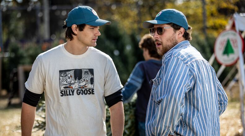 Owners Jack Faught (Left) and Calder Johnson talk during a slow moment at their Trees For Tuition Christmas tree lot in Virginia Highland on Saturday, November 25, 2023. (Steve Schaefer/steve.schaefer@ajc.com)