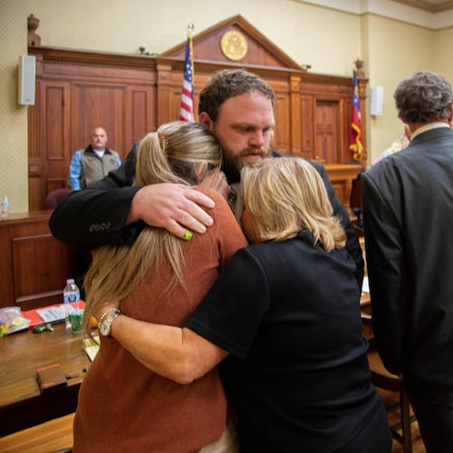 Rhett Scott hugs his wife, Kelly Scott, (left) and his mother, Karen Scott, after being found not guilty of felony murder in the 2017 death of Eurie Martin on Thursday, Nov. 20, 2025, at the trial in Sandersville (Grant Blankenship/Georgia Public Broadcasting via AP)