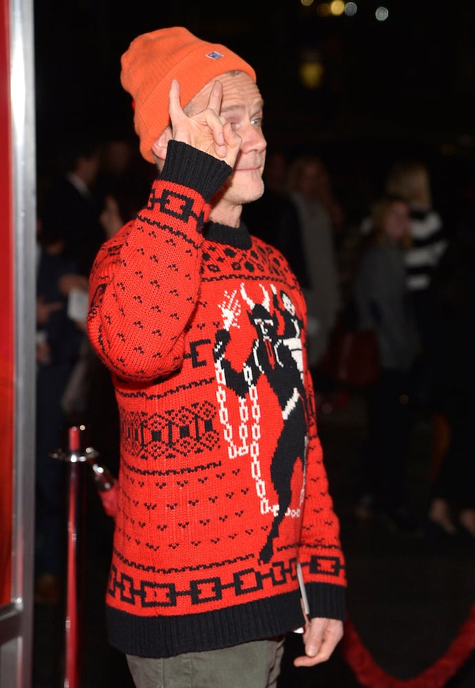 Celebs sport ugly Christmas sweaters