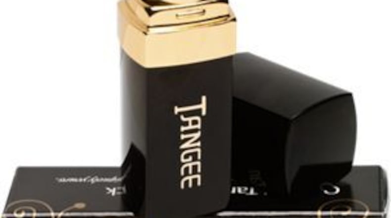 Tangee lipstick looks orange in the tube, but it adjusts to your skin, giving your lips a pink tint.