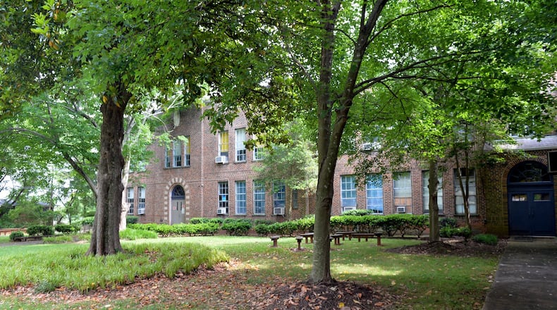 The future of the former Hubert Elementary School property on Memorial Drive in Atlanta has been a subject of close scrutiny for several years. In June, the Atlanta Board of Education agreed to lease the parking lot on the site to a construction company working on a nearby project. KENT D. JOHNSON/AJC/2014 file photo