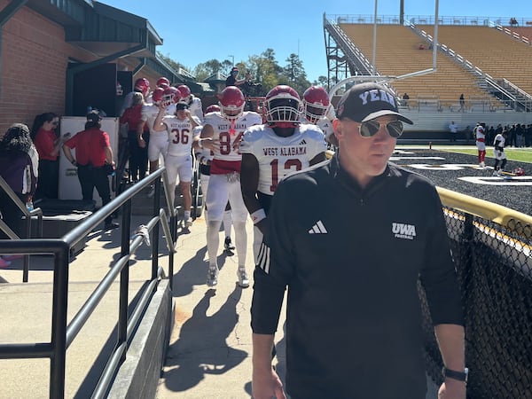 Scott Cochran leads his West Alabama team out of the locker room and onto the field to face Valdosta State on Nov. 1, 2025 (Jack Leo/AJC).