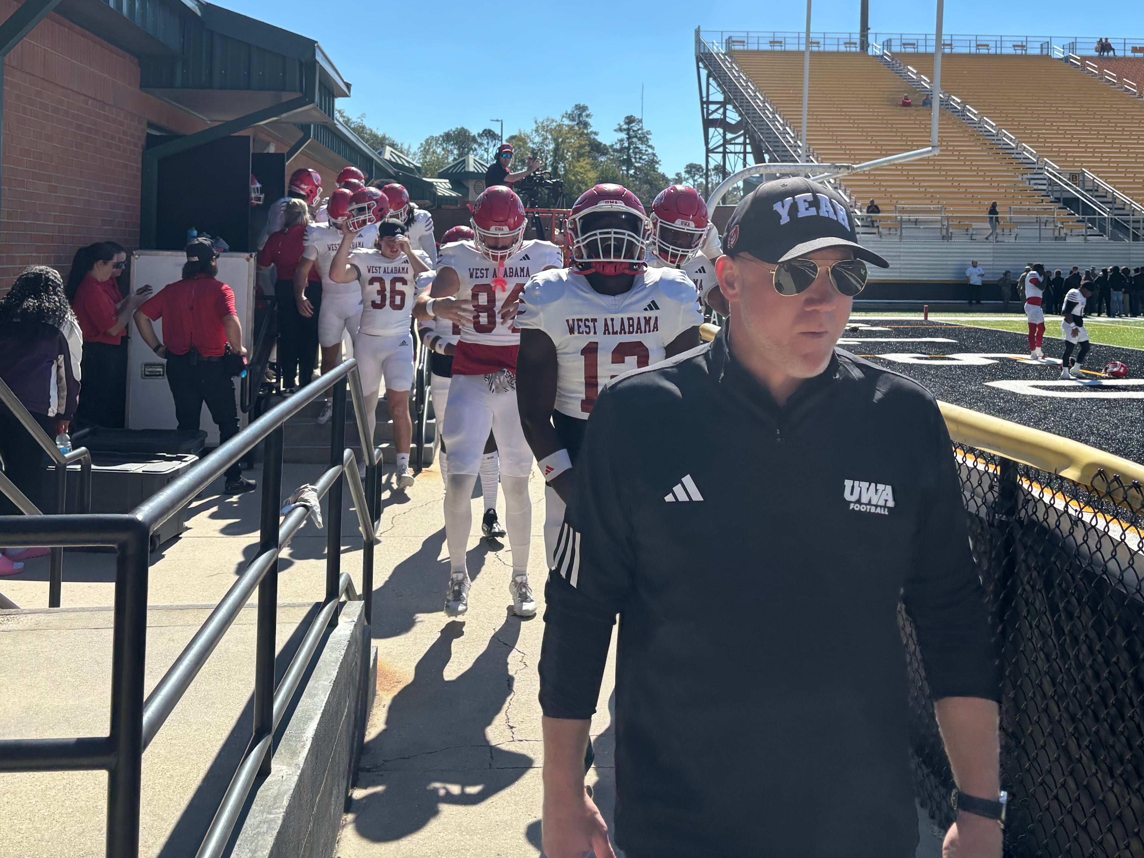 Scott Cochran leads his West Alabama team out of the locker room and onto the field to face Valdosta State on Nov. 1, 2025 (Jack Leo/AJC).