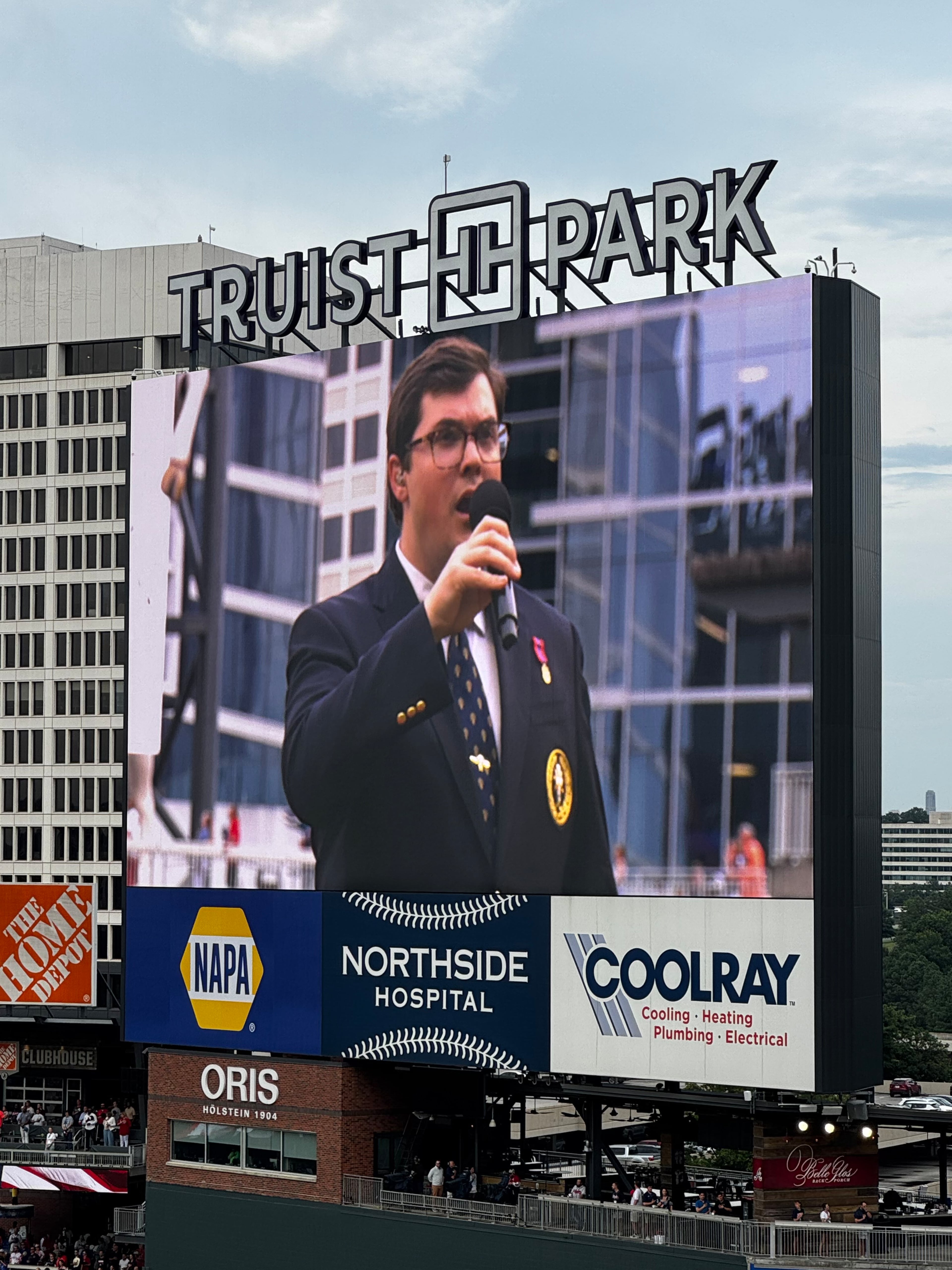 Bryan Lewis, seen on the screen at an Atlanta Braves game singing the national anthem. Bryan sings in his church choir. (Courtesy of Jennifer Lewis and family)