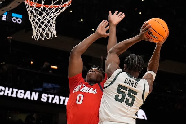 Michigan State forward Coen Carr (55) shoots against Mississippi forward Malik Dia (0) during the first half in the Sweet 16 of the NCAA college basketball tournament, Friday, March 28, 2025, in Atlanta. (AP Photo/Brynn Anderson)