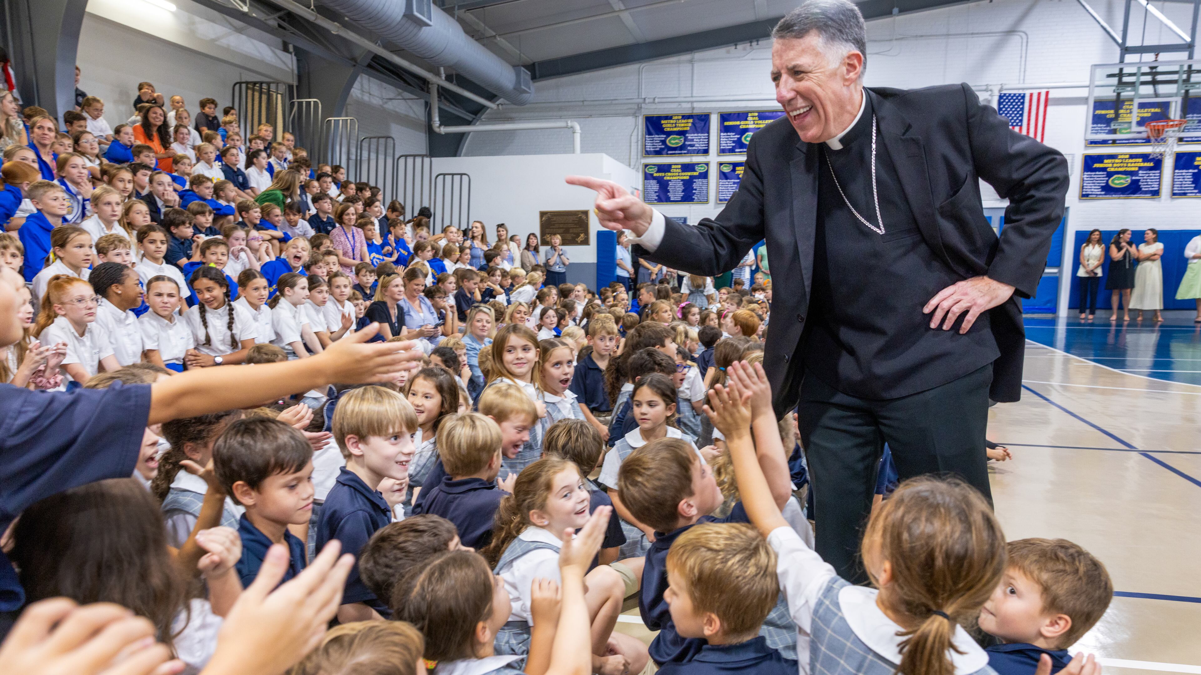 Most Rev. Fr. James F. Checchio meets students at St. Catherine of Siena in Metairie during his introduction as the next Archbishop of New Orleans on Wednesday, Sept. 24, 2025, in New Orleans. (Chris Granger/The Times-Picayune/The New Orleans Advocate via AP)