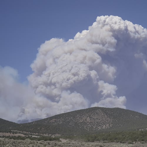 A plume of smoke rises from the Cottonwood Fire, Friday, June 26, 2026, near Beaver, Utah. (AP Photo/Ty ONeil)