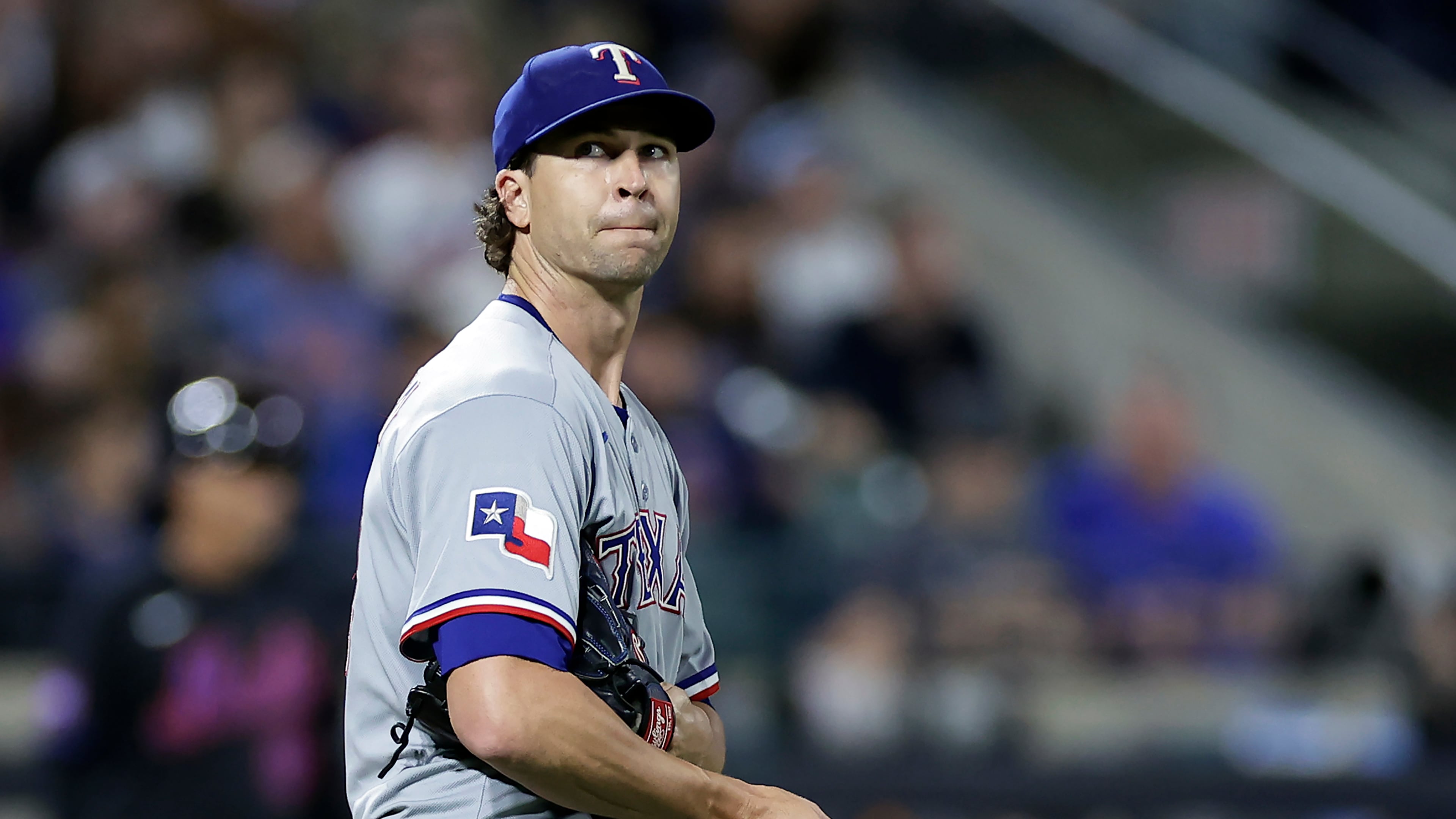 Texas Rangers pitcher Jacob deGrom reacts during the fifth inning of a baseball game against the New York Mets, Friday, Sept. 12, 2025, in New York. (AP Photo/Adam Hunger)