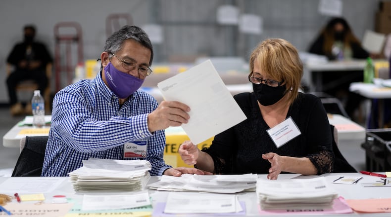 Workers conduct an audit and manual recount of ballots at the Gwinnett County election warehouse in Lawrenceville in November 2020. Ben Gray for The Atlanta Journal-Constitution