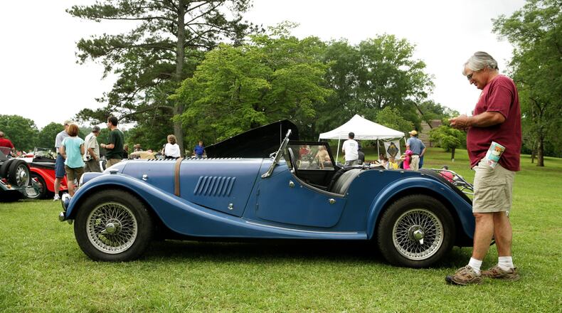 Paul Daole checks out the classic lines of the Morgan, a British sports car that will be part of the British Motorcar Day at Peachtree Corners June 10. CONTRIBUTED BY JACK WALTER