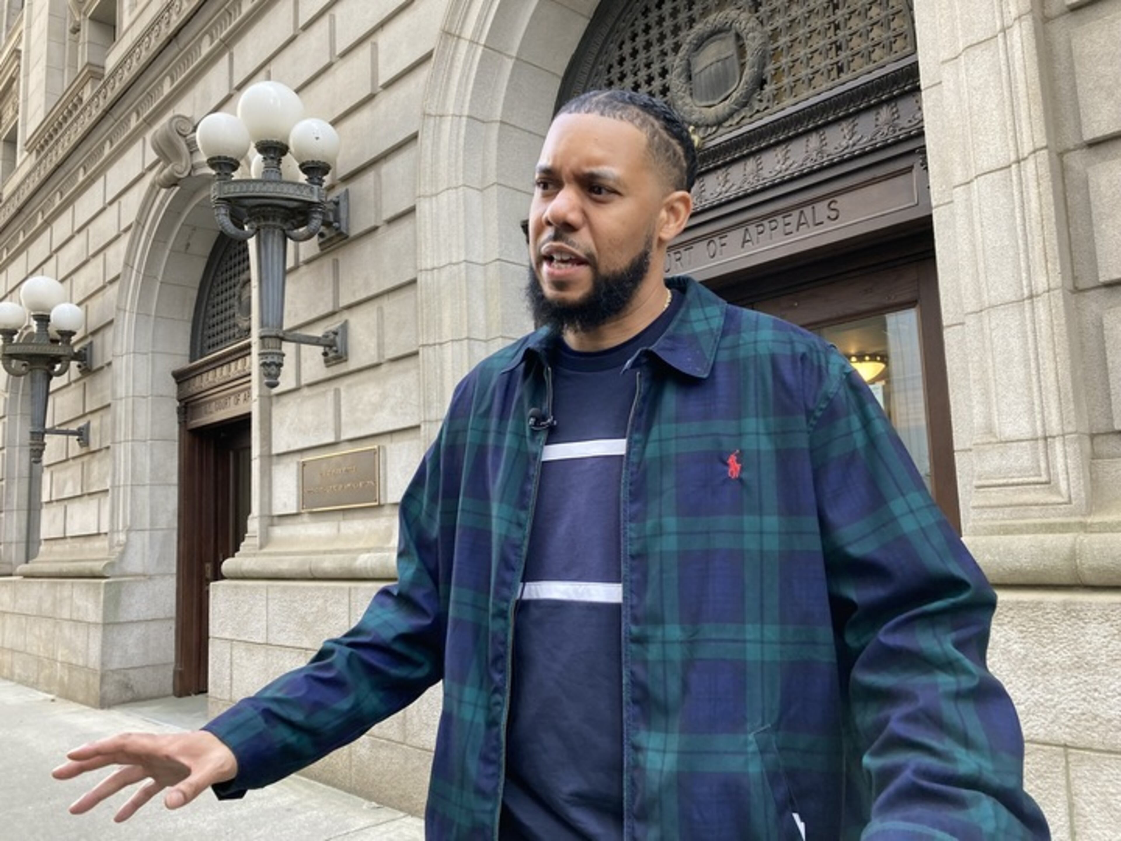 Actor and comedian Clayton English speaks to reporters outside the U.S. Court of Appeals for the 11th Circuit in Atlanta on Friday, March 28, 2025. (Rosie Manins/AJC)