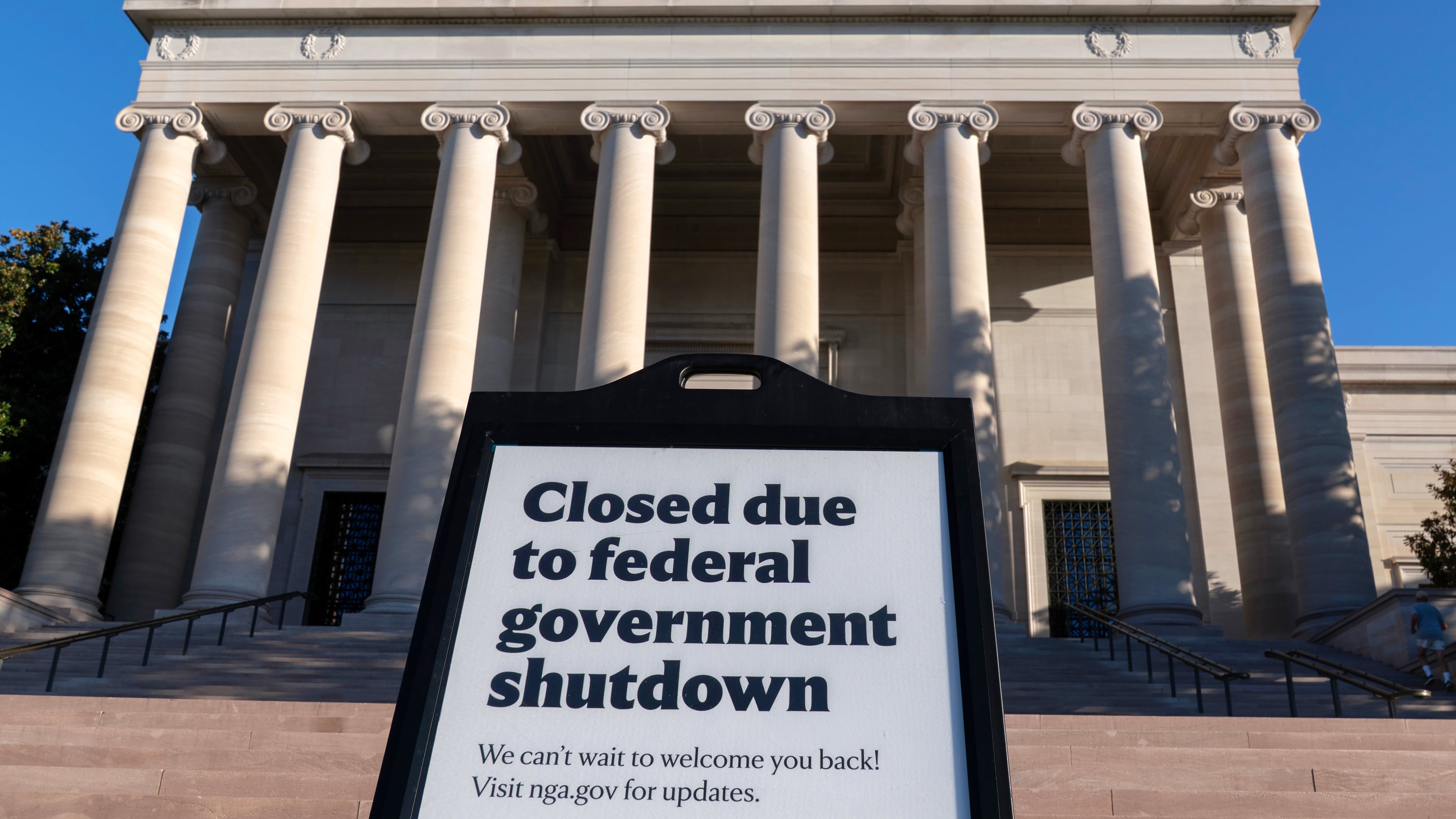 A sign that reads "Closed due to federal government shutdown," is seen outside of the National Gallery of Art on the 6th day of the government shutdown, in Washington, Monday, Oct. 6, 2025. (AP Photo/Jose Luis Magana)