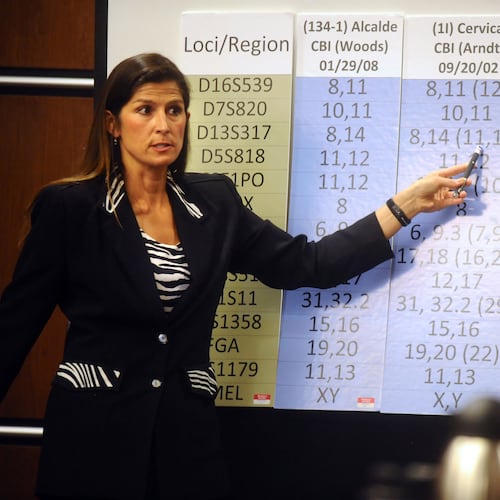 FILE - Yvonne Woods, a lab agent with the Colorado Bureau of Investigation, points to a DNA chart during Diego Olmos Alcalde's trial June 22, 2009 in Boulder, Colo. (Marty Caivano/Daily Camera via AP, Pool, File)