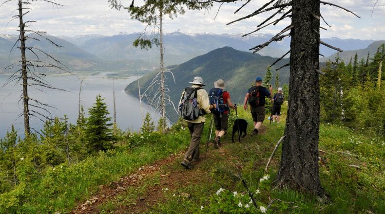 Hikers coming down from Schafer Peak follow a trail on Green Monarch Ridge overlooking Lake Pend Oreille. (RICH LANDERS/THE SPOKESMAN-REVIEW/TNS)