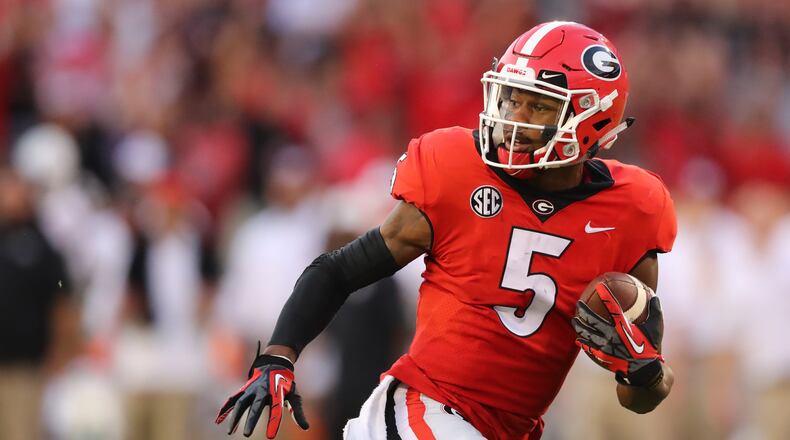 9/23/17 - Athens, GA - Georgia Bulldogs wide receiver Terry Godwin (5) runs for Georgia's first TD after catching a Georgia Bulldogs quarterback Jake Fromm (11) pass during a NCAA college football game in Athens, GA. UGA Bulldogs vs Mississippi State Bulldogs football. CURTIS COMPTON / CCOMPTON@AJC.COM