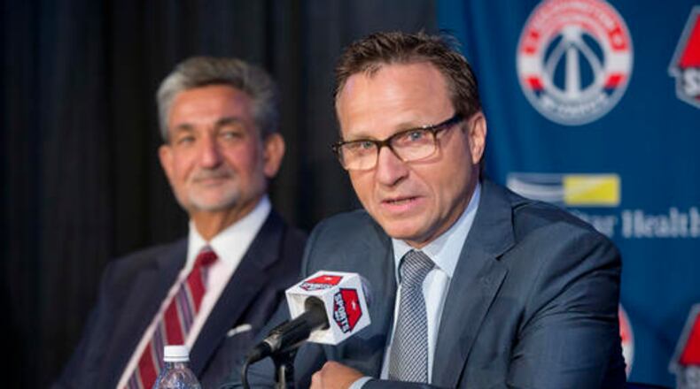 Washington Wizards new head coach Scott Brooks speaks during a news conference at the Verizon Center in Washington, Wednesday, April 27, 2016. Brooks reached a five-year agreement with the team last week. looking on is Wizards majority owner Ted Leonsis. (AP Photo/Pablo Martinez Monsivais)