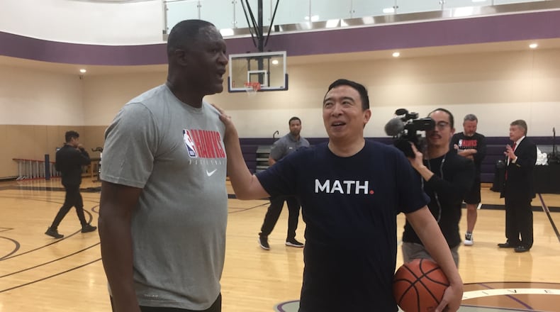 Dominique Wilkins and Andrew Yang on the court Monday.