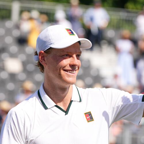 Jannik Sinner of Italy waves to supporters after a tennis exhibition match against Cameron Norrie of Great Britain at the Hurlingham Tennis Club in London, Wednesday, June 24, 2026.(AP Photo/Kirsty Wigglesworth)