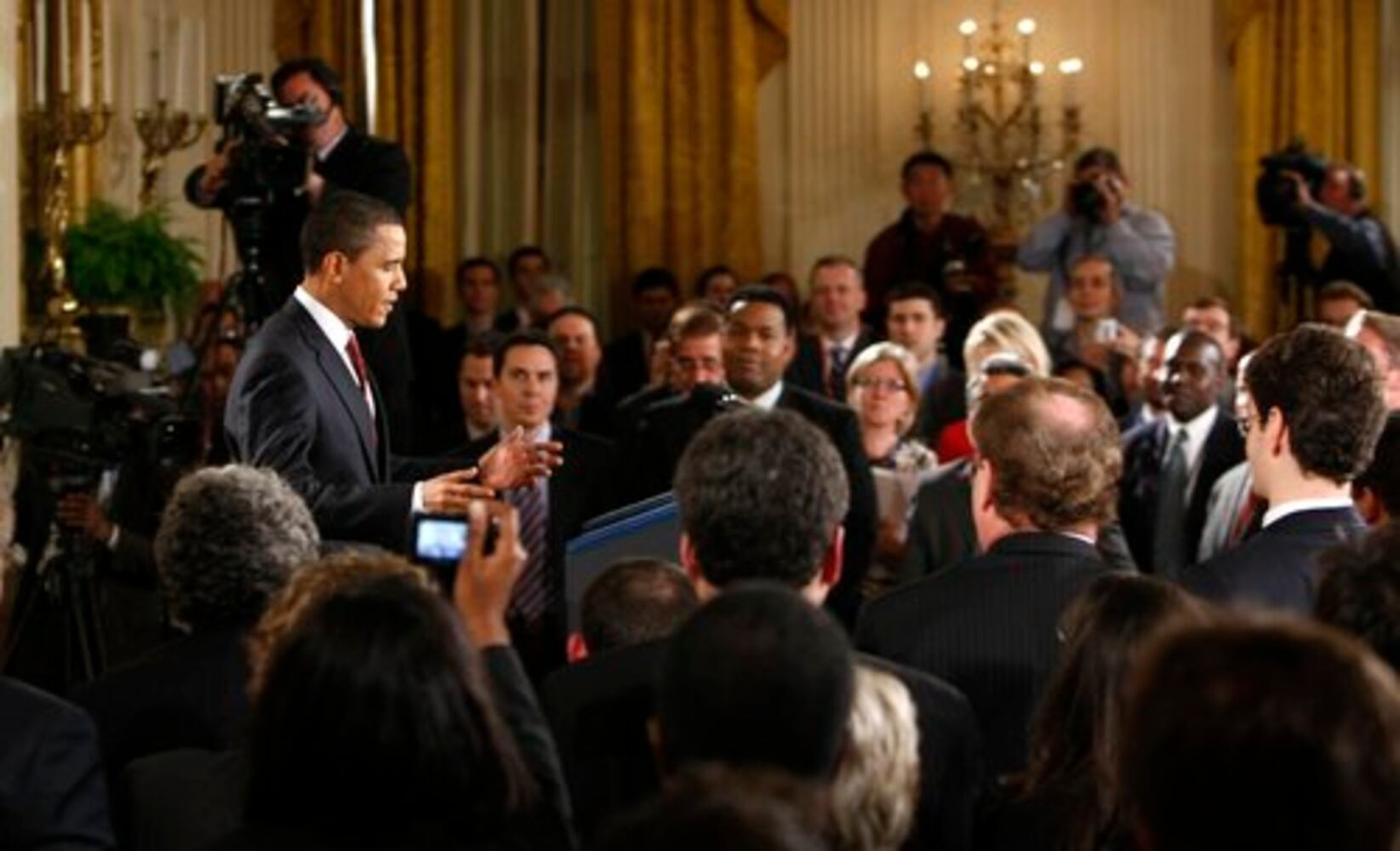 Obama defends plans for economic recovery