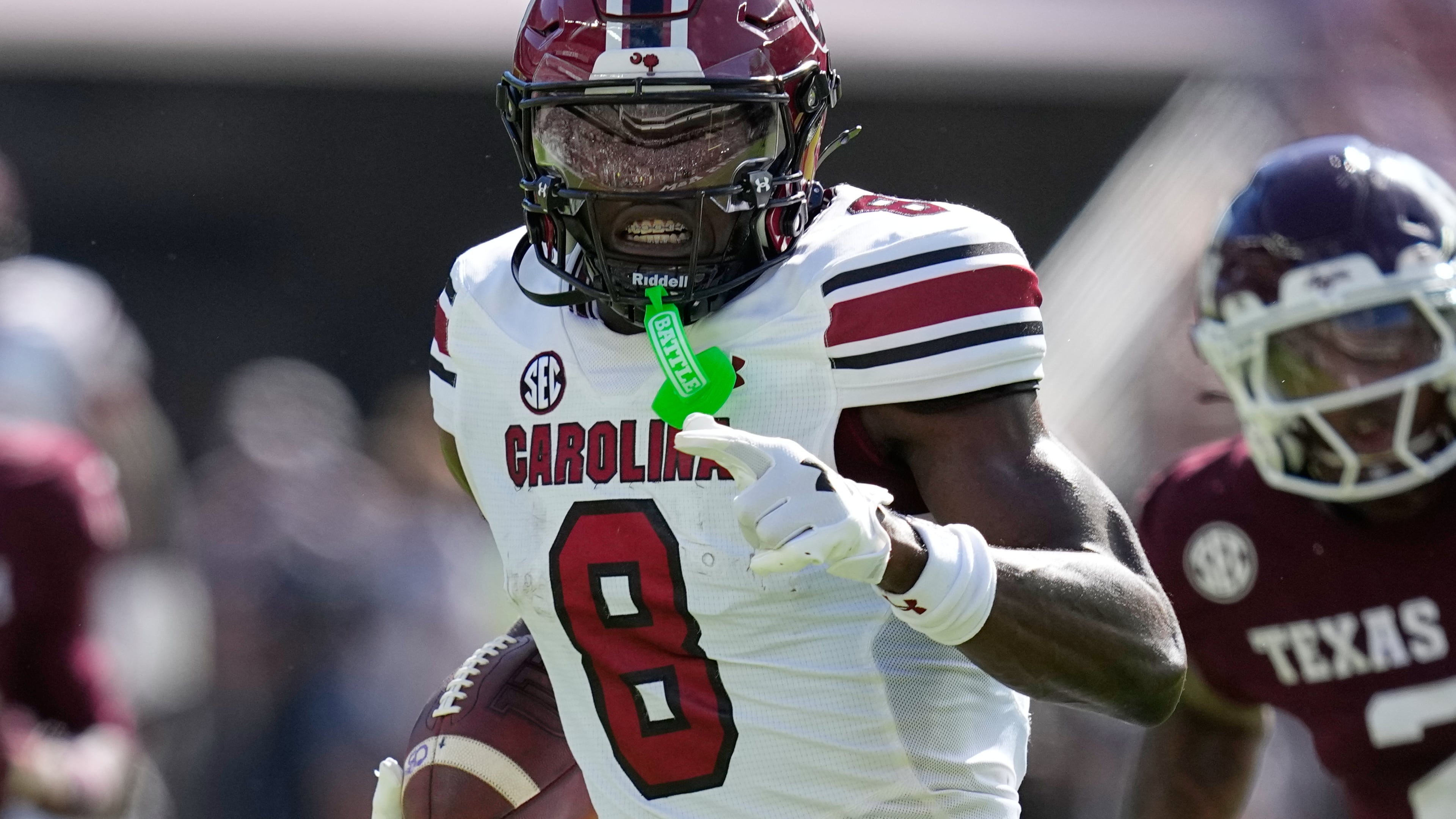 South Carolina wide receiver Nyck Harbor (8) runs for a touchdown after catching a pass as Texas A&M cornerback Dezz Ricks (2) defends during the first half of an NCAA college football game Saturday, Nov. 15, 2025, in College Station, Texas. (AP Photo/David J. Phillip)