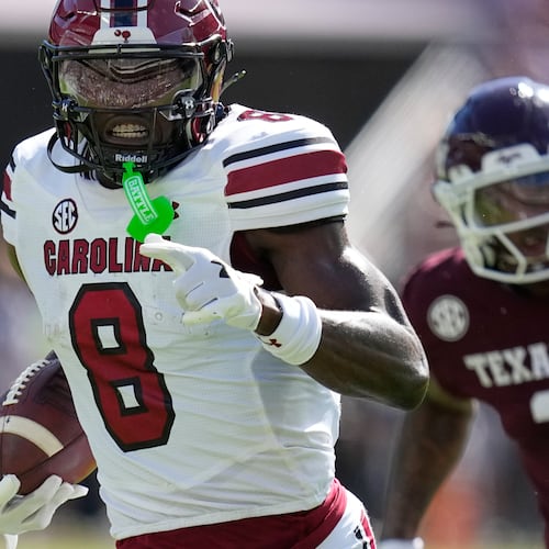 South Carolina wide receiver Nyck Harbor (8) runs for a touchdown after catching a pass as Texas A&M cornerback Dezz Ricks (2) defends during the first half of an NCAA college football game Saturday, Nov. 15, 2025, in College Station, Texas. (AP Photo/David J. Phillip)
