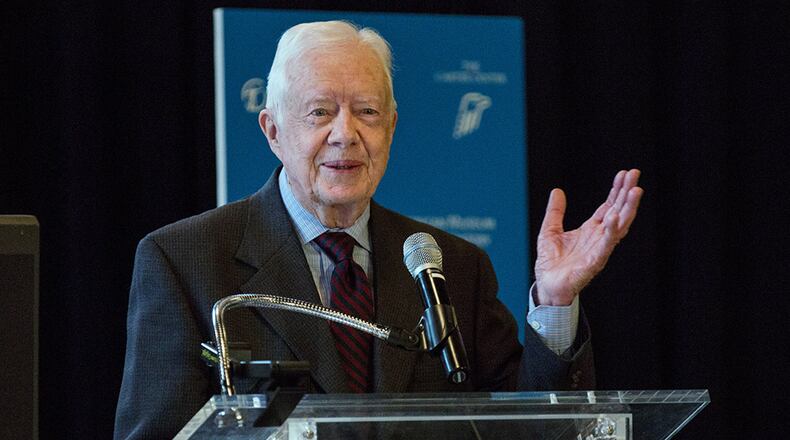 Former U.S. President Jimmy Carter speaks at a press conference to open a new exhibit at the American Museum of Natural History on January 12, 2015 in New York City. The exhibit, titled "Countdown to Zero: Defeating Disease," was developed in collaboration with The Carter Center. (Photo by Andrew Burton/Getty Images)