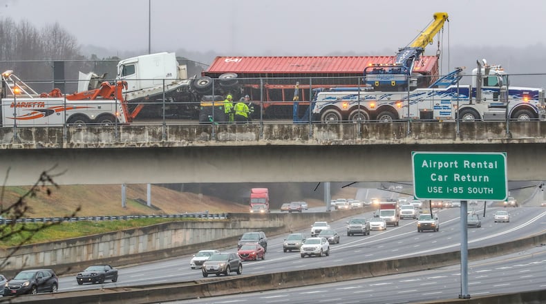All southbound lanes of the Downtown Connector were shut down for hours Monday after a tractor-trailer wrecked on a bridge and dislodged the chain-link fencing.
