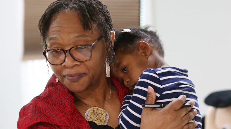 4/19/19 - Sandy Springs - Wanda Irving holds Soleil Irving, 2, in their home in Sandy Springs, Georgia on Friday, April 19, 2019. Wanda Irving is raising her granddaughter, Soleil. Her daughter, Dr. Shalon Irving, died in 2017 shortly after giving birth. Wanda Irving's daughter, Shalon, 36, died of cardiac arrest from complications related to hypertension three weeks after giving birth. EMILY HANEY / emily.haney@ajc.com