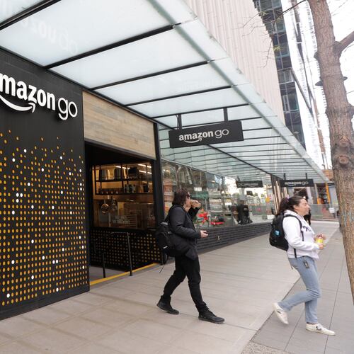 FILE - People walk out of an Amazon Go store in Seattle, March 4, 2020. (AP Photo/Ted S. Warren, File)