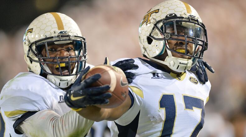 Georgia Tech defensive back Lance Austin (17) is celebrated by twin brother and defensive back Lawrence Austin after he scored a touchdown at the end of the fourth quarter at Bobby Dodd Stadium on Saturday, October 24, 2015. Georgia Tech won 22 - 16 over Florida State. HYOSUB SHIN / HSHIN@AJC.COM