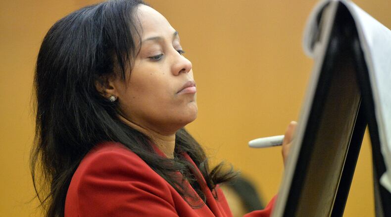 Fulton County Chief Senior Assistant DA Fani Willis writes on a chart as she questions prosecution witness Sharron Pitts on Wednesday. (Kent D. Johnson, Atlanta Journal-Constitution)