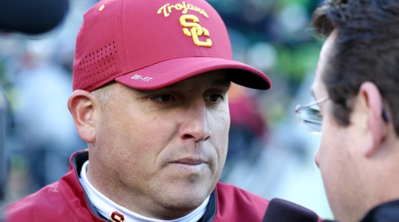Southern California head coach Clay Helton is seen during the second half of an NCAA college football game against Southern California, Saturday, Nov. 21, 2015, in Eugene, Ore. (AP Photo/Ryan Kang)