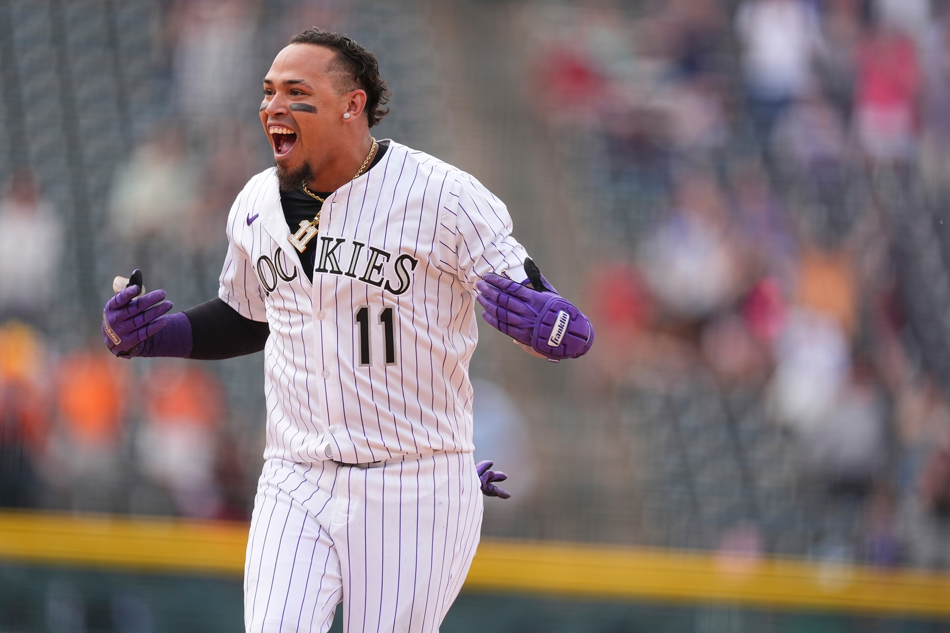 Colorado Rockies' Orlando Arcia celebrates after hitting a walkoff single to drive in two runs in the ninth inning of a baseball game against the San Francisco Giants on June 12, 2025, in Denver. (David Zalubowski/AP)