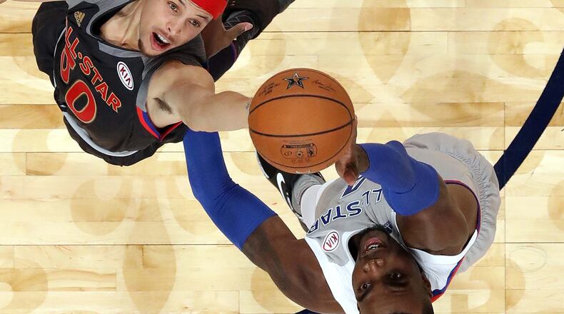 Stephen Curry of the Golden State Warriors jumps for a rebound with Paul Millsap (right) of the Atlanta Hawks during 2017 NBA All-Star Game at Smoothie King Center on February 19, 2017 in New Orleans, Louisiana. (Photo by Ronald Martinez/Getty Images)