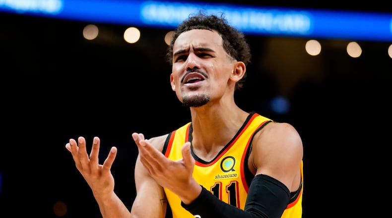 Atlanta Hawks guard Trae Young (11) argues a call in the first half of an NBA basketball game against the Utah Jazz Thursday, Nov. 4, 2021, in Atlanta. (AP Photo/John Bazemore)