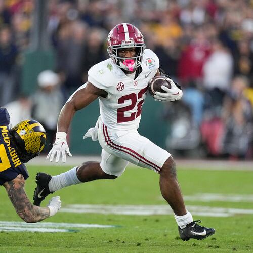 Running back Justice Haynes (center) — pictured playing for Alabama in the Rose Bowl in 2024 — is transferring from Michigan to Georgia Tech. (Mark J. Terrill/AP 2024)