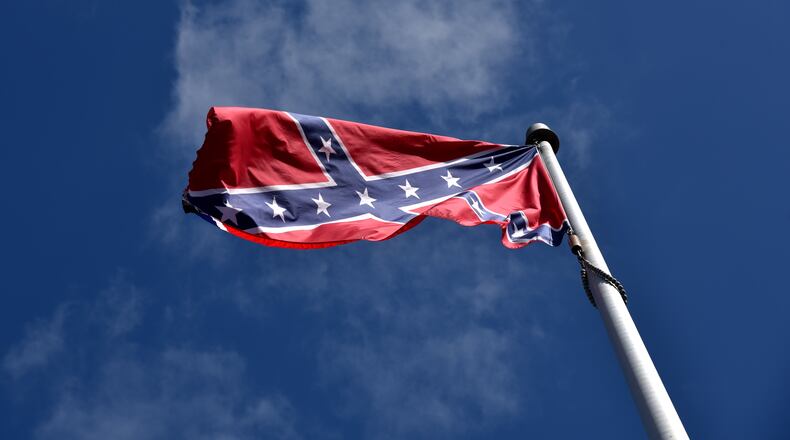 Kennesaw leaders will vote Monday to consider keeping the Confederate battle flag permanently off its war memorial. BRANT SANDERLIN/BSANDERLIN@AJC.COM