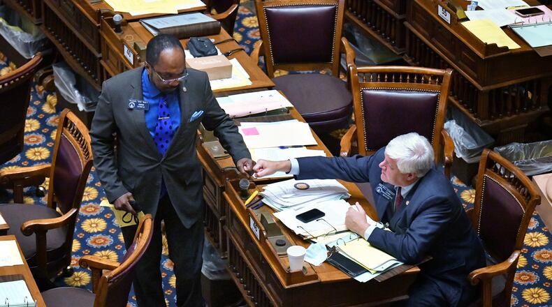 June 23, 2020 Atlanta - Sen. Michael 'Doc' Rhett (D-Marietta), left, and Sen. Bill Cowsert (R-Athens) give each other a fist bump after Sen. Michael 'Doc' Rhett spoke to support HB-426 in the Senate Chambers on day 37 of the legislative session at Georgia State Capitol on Tuesday, June 23, 2020. HB-426 passed. The bill would implement stiffer penalties if those guilty of crimes are found to have been motivated by hate. (Hyosub Shin / Hyosub.Shin@ajc.com)