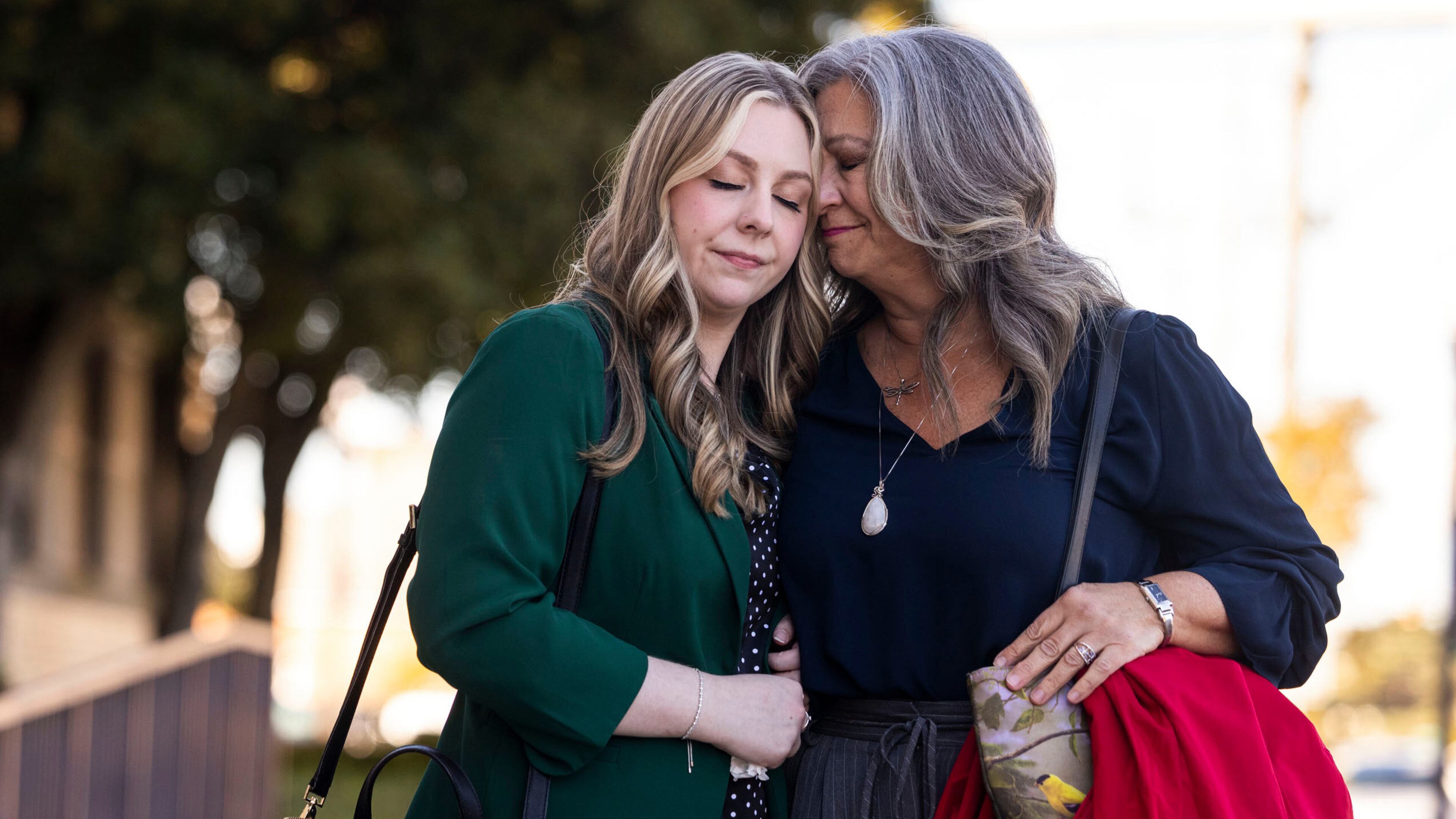 Abby Zwerner shares a moment with her mother Julie Zwerner after a verdict was reached in her lawsuit against the assistant principal, Ebony Parker, of Richneck Elementary School during proceedings at Newport News Circuit Court in Newport News, Va. on Thursday, Nov. 6, 2025. (Kendall Warner/The Virginian-Pilot via AP)