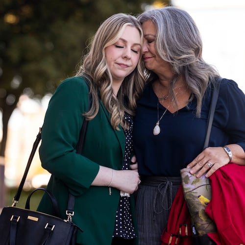 Abby Zwerner shares a moment with her mother Julie Zwerner after a verdict was reached in her lawsuit against the assistant principal, Ebony Parker, of Richneck Elementary School during proceedings at Newport News Circuit Court in Newport News, Va. on Thursday, Nov. 6, 2025. (Kendall Warner/The Virginian-Pilot via AP)