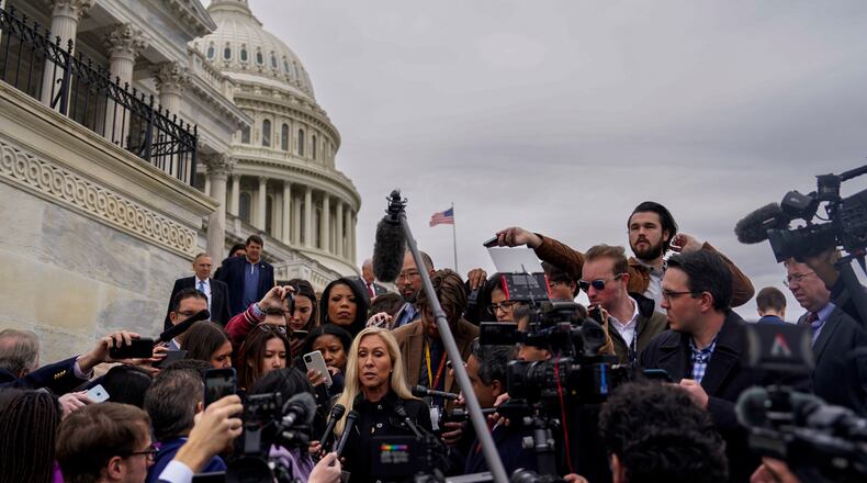 Rep. Marjorie Taylor Greene (R-Ga.) speaks to reporters on the steps of the House on Capitol Hill in Washington, March 22, 2024. Greene on Friday took the first step toward ousting House Speaker Mike Johnson, filing a resolution calling for his removal after he pushed through a $1.2 trillion bipartisan spending bill that enraged the hard right. (Kent Nishimura/The New York Times)