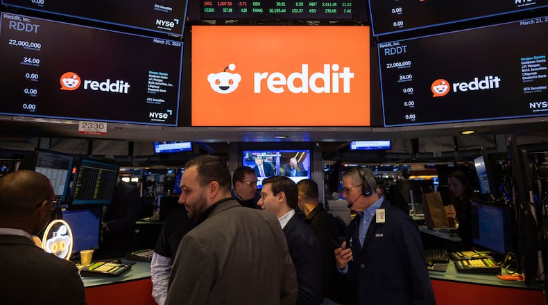 FILE - Reddit Inc. logos are displayed on the New York Stock Exchange trading floor, prior to the company's IPO, Thursday, March. 21, 2024. (AP Photo/Yuki Iwamura, File)