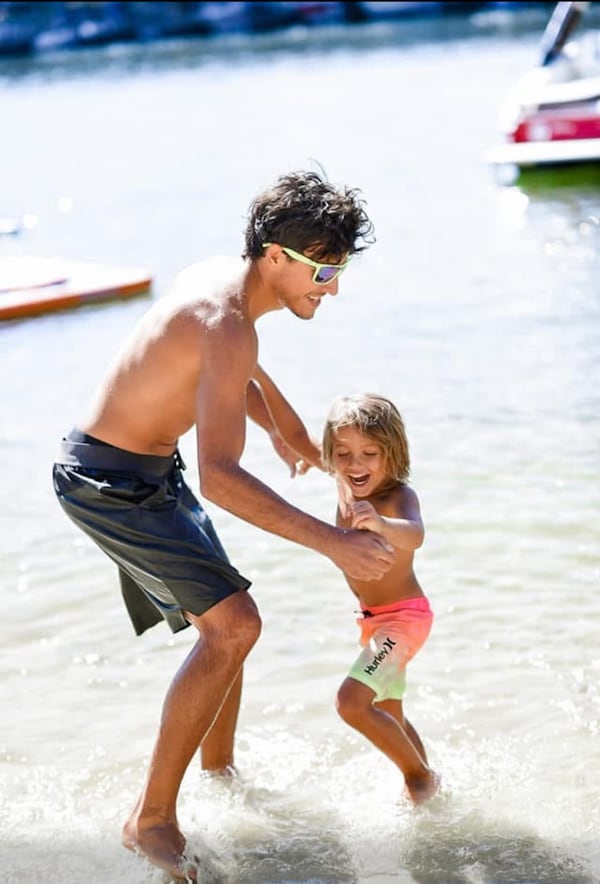 Mark Moczarski is seen playing in the water with 8-year-old Maksym, who is the son of his brother Mike Moczarski. (Family photo)