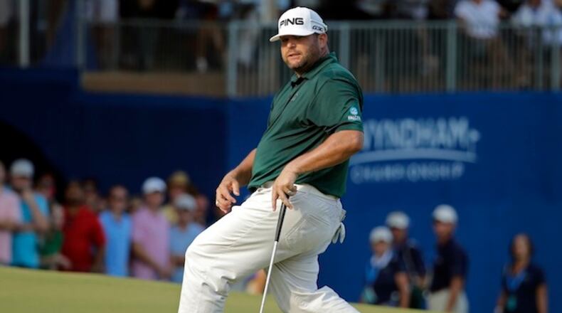 Jason Gore reacts after missing a birdie putt on the 18th hole that would have tied him with the leader during the final round of the Wyndham Championship golf tournament at Sedgefield Country Club in Greensboro, N.C., Sunday, Aug. 23, 2015. Davis Love III won the tournament. (AP Photo/Chuck Burton)