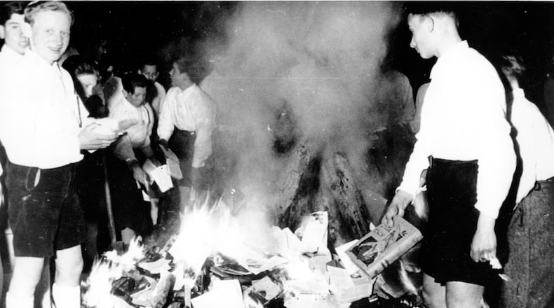 Members of the Hitler Youth participate in burning books in Salzburg, Austria, on April 30, 1938.  (Associated Press, File)