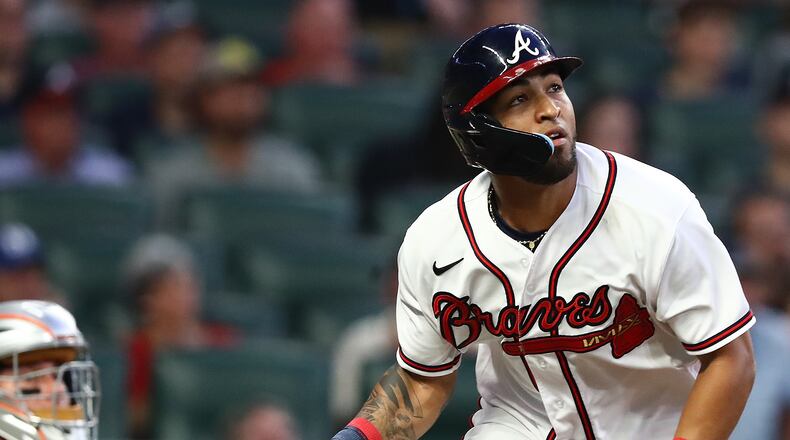 Braves outfielder Eddie Rosario watches his solo home run against the Mets on Monday night at Truist Park. Rosario exited Monday’s 13-1 walloping of the Mets in the sixth inning with left-hamstring tightness. (Curtis Compton / Curtis Compton@ajc.com)