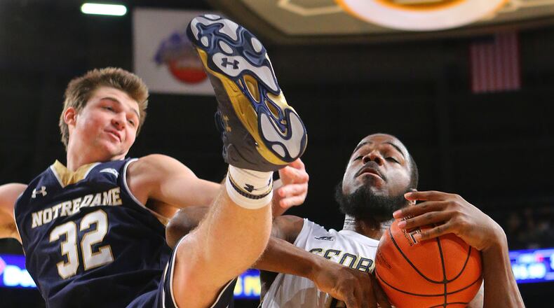 Georgia Tech's Demarco Cox battles Notre Dame's Steve Vasturia (32) for a rebound during the second half at McCamish Pavilion in Atlanta on Wednesday, Jan. 14, 2015. Notre Dame won, 62-59. (Curtis Compton/Atlanta Journal-Constitution/TNS) Georgia Tech center Demarco Cox's career-high 17 points were not enough to lift the Yellow Jackets to their first ACC win of the season. (ASSOCIATED PRESS)