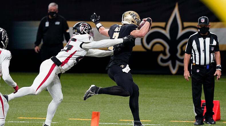 Saints quarterback Taysom Hill (7) enters the end zone for a touchdown just out of the reach of Falcons linebacker Deion Jones (45) in the second half Sunday, Nov. 22, 2020, in New Orleans. (Butch Dill/AP)